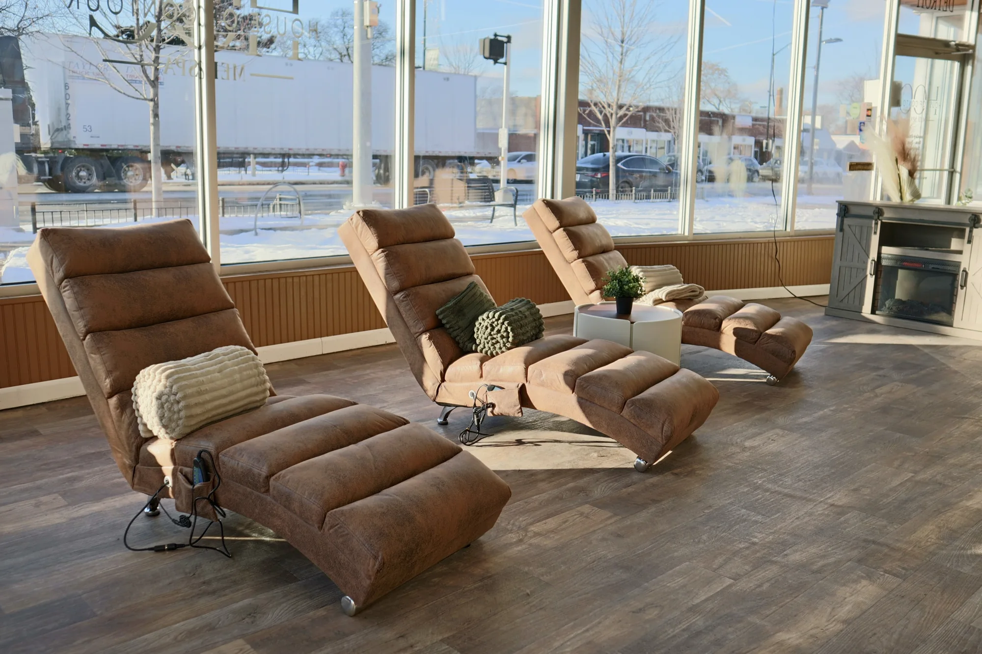 Caramel recliners by the windows at House of Contour